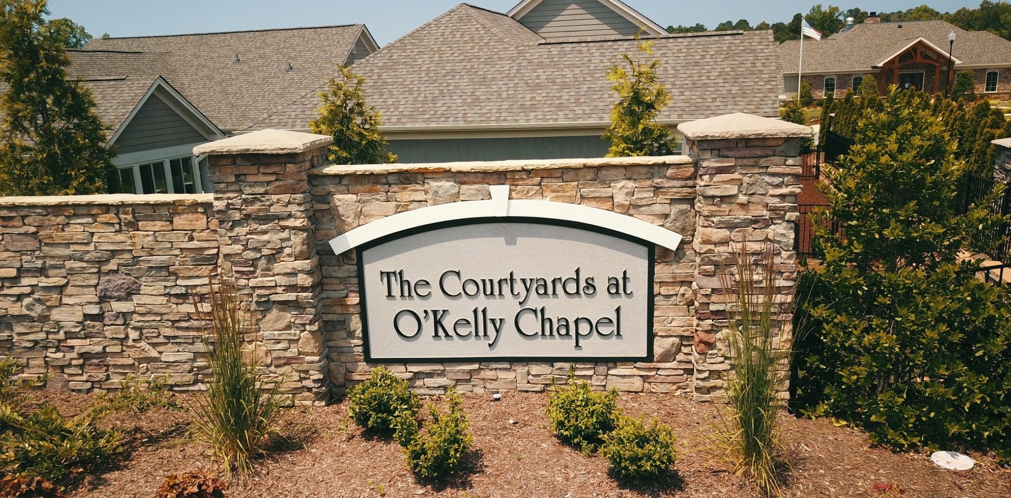 Entrance to the Courtyards at O'Kelly Chapel by Epcon Properties